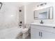Stylish bathroom featuring a tub, marble wall, and modern vanity with black accents at 2553 Showcase Dr, Las Vegas, NV 89134