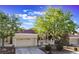 Inviting single-story home featuring a red tile roof, well-maintained landscaping, and an attached two-car garage at 2553 Showcase Dr, Las Vegas, NV 89134