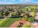 Picturesque view of the golf course community with lush fairways and tree-lined streets, with mountain views at 2553 Showcase Dr, Las Vegas, NV 89134
