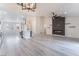 Open concept living room with a kitchen and a fireplace at 2553 Showcase Dr, Las Vegas, NV 89134