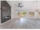 Open concept living room featuring a contemporary fireplace and sliding doors to a patio at 2553 Showcase Dr, Las Vegas, NV 89134