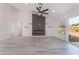 Bright living room featuring a fireplace and sliding glass doors to the outdoors at 2553 Showcase Dr, Las Vegas, NV 89134