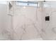 Close-up of a shower featuring marble-look tile at 2553 Showcase Dr, Las Vegas, NV 89134