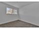 Bright bedroom with neutral carpet and a window providing ample natural light at 2721 Bruce Cir, North Las Vegas, NV 89030