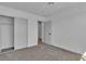 Bedroom with carpet, white walls, closet and door that leads to another room at 2721 Bruce Cir, North Las Vegas, NV 89030