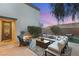 Cozy backyard patio with comfortable seating, lush greenery, and a serene atmosphere, perfect for relaxation and entertaining at 2768 Tyndrum Ave, Henderson, NV 89044