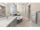 Spacious bathroom boasts dual vanities, soaking tub, stylish tile, and ample lighting at 2768 Tyndrum Ave, Henderson, NV 89044