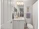 Clean bathroom with modern fixtures, white vanity, and a neutral color scheme, creating a relaxing atmosphere at 2768 Tyndrum Ave, Henderson, NV 89044