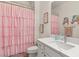 Charming bathroom featuring a pink shower curtain, white vanity, and a decorative zebra at 2768 Tyndrum Ave, Henderson, NV 89044