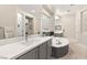 Luxurious bathroom with dual vanities, soaking tub, decorative tile, and ample space at 2768 Tyndrum Ave, Henderson, NV 89044