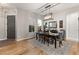 Formal dining room with stylish lighting, a large window, and seating for six at 2768 Tyndrum Ave, Henderson, NV 89044