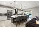 Spacious kitchen featuring a large island, stainless steel appliances, and modern white cabinets at 2768 Tyndrum Ave, Henderson, NV 89044