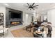 Modern living room with a sleek fireplace, large TV, and comfortable seating area at 2768 Tyndrum Ave, Henderson, NV 89044