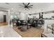 Open-concept living room connected to a kitchen, featuring modern decor and comfortable seating at 2768 Tyndrum Ave, Henderson, NV 89044