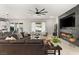 Bright and open living room featuring a fireplace, comfortable seating, and access to the backyard, perfect for relaxation at 2768 Tyndrum Ave, Henderson, NV 89044