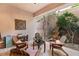 Charming outdoor patio with stone flooring, comfortable seating, and lush greenery offering a private retreat at 2768 Tyndrum Ave, Henderson, NV 89044