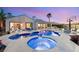 Stunning pool and spa with lounge area, lush landscaping, and a basketball court perfect for outdoor relaxation and recreation at 2768 Tyndrum Ave, Henderson, NV 89044