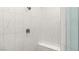 Modern shower features white marble tile, built-in bench, and sleek fixtures at 2768 Tyndrum Ave, Henderson, NV 89044