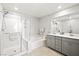 Spa-like bathroom with a glass-enclosed shower, soaking tub, and double vanity at 2816 Turnstone Ridge St, Henderson, NV 89044
