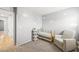 Bedroom features a crib and comfortable armchair at 2816 Turnstone Ridge St, Henderson, NV 89044