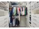 Well-organized walk-in closet with custom shelving and ample storage space for clothing and accessories at 2816 Turnstone Ridge St, Henderson, NV 89044