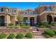 Charming two-story home with landscaped yard and brick steps to covered porch at 2816 Turnstone Ridge St, Henderson, NV 89044