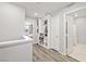 Hallway features built in bookcases and wood-look flooring at 2816 Turnstone Ridge St, Henderson, NV 89044