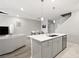 Modern kitchen with center island, open to the living area, offering a seamless flow at 2816 Turnstone Ridge St, Henderson, NV 89044