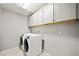 Bright laundry room equipped with modern washer and dryer at 2816 Turnstone Ridge St, Henderson, NV 89044