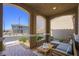 Cozy covered patio with comfortable seating, perfect for relaxing outdoors at 2816 Turnstone Ridge St, Henderson, NV 89044