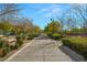 Walking path in community park with trees and benches at 2816 Turnstone Ridge St, Henderson, NV 89044