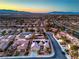 Spacious property with a view of the surrounding suburban neighborhood and mountains in the distance at 3002 Hickory Valley Rd, Henderson, NV 89052