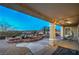 Covered patio area overlooking the backyard and mountain views at 3002 Hickory Valley Rd, Henderson, NV 89052