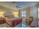 Primary bedroom featuring a ceiling fan and a window with shutters at 3002 Hickory Valley Rd, Henderson, NV 89052