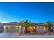 Charming single-story home featuring a desert landscape, two-car garage, and a welcoming front entrance at 3002 Hickory Valley Rd, Henderson, NV 89052