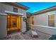 Close-up of the front entrance, highlighting the decorative gate and well-maintained landscaping at 3002 Hickory Valley Rd, Henderson, NV 89052
