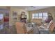 Comfortable living room with stylish furnishings, large windows, and an open layout at 3002 Hickory Valley Rd, Henderson, NV 89052