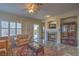 Bright living room boasting a fireplace, sliding doors, and comfortable seating on elegant flooring at 3002 Hickory Valley Rd, Henderson, NV 89052