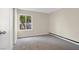 Cozy bedroom with neutral carpet and a bright window allowing natural light at 317 E Van Wagenen St, Henderson, NV 89015