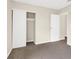 Bedroom showing a walk-in closet with neutral carpet at 317 E Van Wagenen St, Henderson, NV 89015