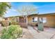 Charming townhome featuring a well-kept front yard with desert landscaping and an inviting entrance at 317 E Van Wagenen St, Henderson, NV 89015