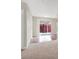 Bright living area with sliding glass door, hardwood flooring and neutral walls at 317 E Van Wagenen St, Henderson, NV 89015