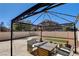 A beautiful backyard featuring a stone patio with outdoor furniture, a pergola, and a privacy fence at 3313 Jamaica Princess Pl # 3, North Las Vegas, NV 89084