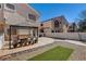 The property boasts a cozy backyard space with stone patio, pergola, and privacy fencing at 3313 Jamaica Princess Pl # 3, North Las Vegas, NV 89084