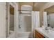 Cozy bathroom featuring a bathtub, shower, and sink with a mirror and natural light; bright and airy at 3313 Jamaica Princess Pl # 3, North Las Vegas, NV 89084