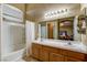 Bathroom featuring a double sink vanity, and a separate tub/shower combo; bright and functional at 3313 Jamaica Princess Pl # 3, North Las Vegas, NV 89084