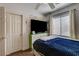 Charming bedroom with a window, modern ceiling fan, and closet at 3313 Jamaica Princess Pl # 3, North Las Vegas, NV 89084
