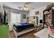Stylishly decorated bedroom featuring a cozy bed, ample storage, and a ceiling fan at 3313 Jamaica Princess Pl # 3, North Las Vegas, NV 89084
