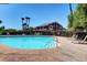 Sparkling community pool with ample seating and mature landscaping, perfect for relaxation at 3313 Jamaica Princess Pl # 3, North Las Vegas, NV 89084