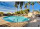 A beautiful pool with palm trees, a shower house, and clear water create a perfect community oasis at 3313 Jamaica Princess Pl # 3, North Las Vegas, NV 89084